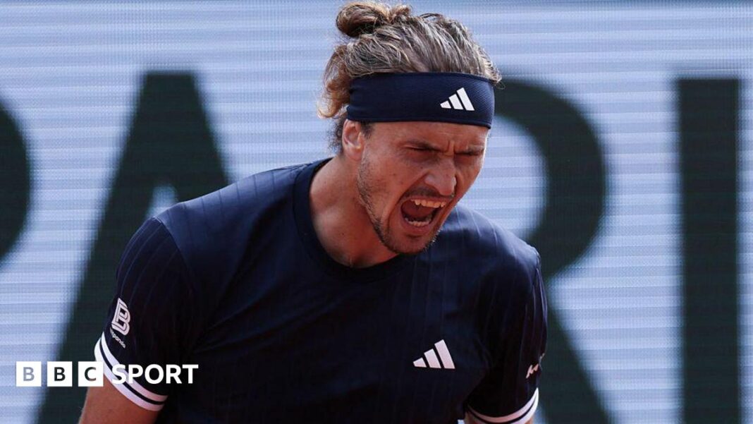 Rezultati French Opena 2026: Alexander Zverev pobijedio Jakuba Mensika i stigao do četvrtog Grand Slam finala Alexander Zverev, wearing a black Adidas t-shirt and headband with his hair tied back, roars with his mouth open